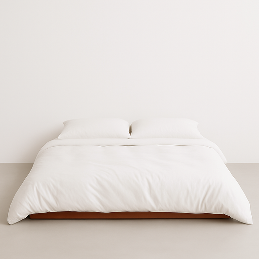 White Bamboo Bedding on a wooden bed frame with a neutral background